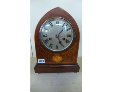 An early 20th century mahogany and inlaid lancet mantle clock striking on a gong