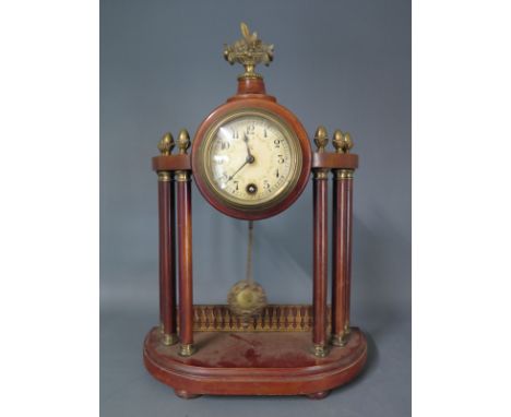 A Portico mantel clock made by H.A.C. with Arabic numerals to dial