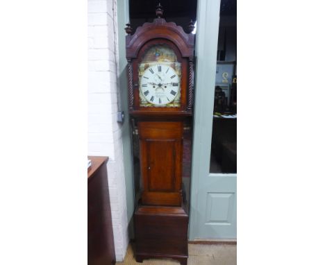 A Georgian mahogany cased eight day long case clock with domed hood, carved finial, rope twist supports circular painted dial