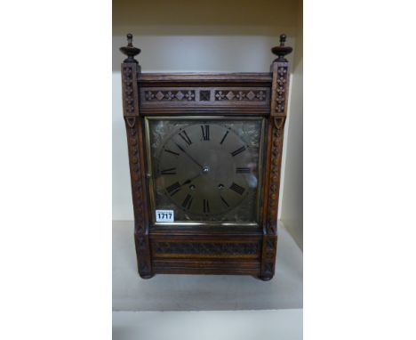 An oak case bracket clock with a silvered dial eight day movement, quarter chimes on two coiled gongs - Height 41cm x Width 2