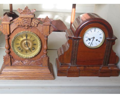 A walnut mantel clock and an oak Ansonia mantel clock - both with pendulums - Height 37cm 
