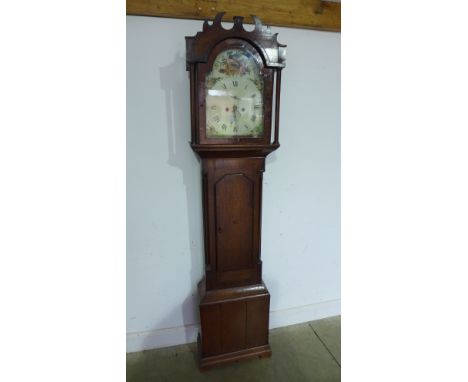 A 19th century oak eight day longcase clock with a painted arched 12" dial, having pendulum and weights - Height  80"