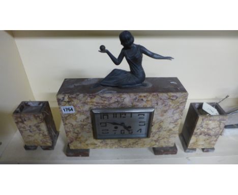 An Art Deco marble clock garniture set surmounted by a lady in typical pose - Height 38cm 