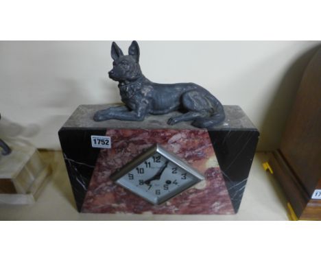 An Art Deco marble mantel clock surmounted by a spelter German shepherd dog - Height 32cm 
Condition report: No pendulum
