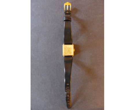 A late 1950's 18k Ladies wristwatch by Delano, retailed by Liberty, with stick markers & pencil hands upon gilt - 17mm square