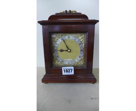 A modern mantle clock with a brass dial signed Thwaites and Reed - Height 20cm