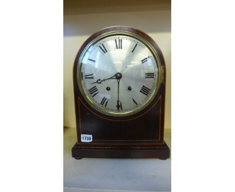A mahogany case bracket clock with quarter chimes on four coiled gongs plus gong for hour strikes, 8" silvered dial, Roman nu