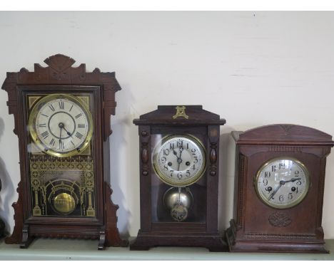 A Gingerbread mantel clock and two others
Condition report:  For restoration