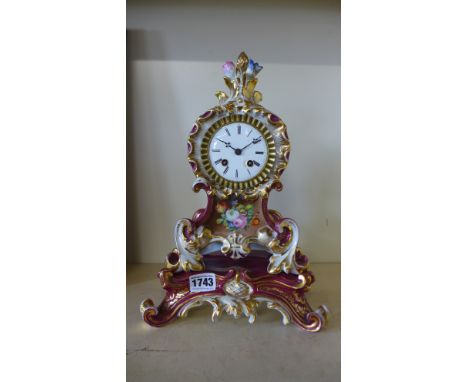A 19th century porcelain French clock by Frier of Paris, silk suspension bell strike - Height 33 cm 