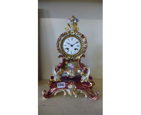 A 19th century porcelain French clock by Frier of Paris, silk suspension bell strike - Height 33 cm 