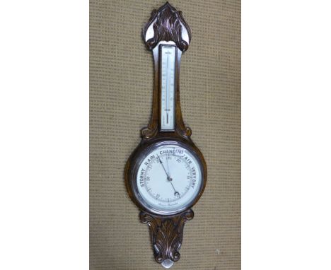 An oak case Banjo barometer with thermometer above - Height 83cm 
Condition report: Working 