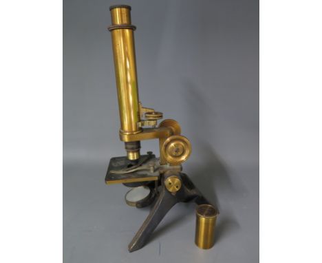 A Victorian brass Microscope with lacquered upper and black iron base, signed to the base F. Davidson & Co London W - include