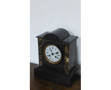 A 19th century French black marble mantel clock with coloured marble inserts, circular dial with Roman numerals - 29cm x 24cm