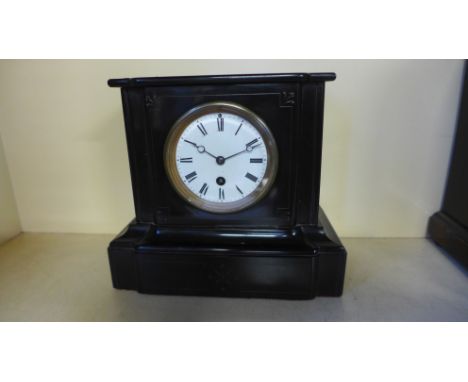 A late 19th century black slate mantel clock with a 4" Roman dial, eight day timepiece 
Condition report: Not working 