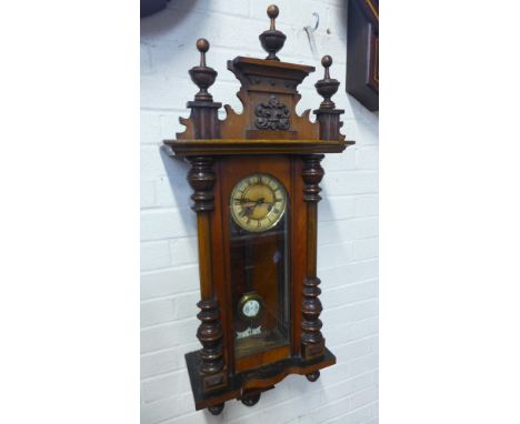An 8 day Vienna style wall clock striking on a gong