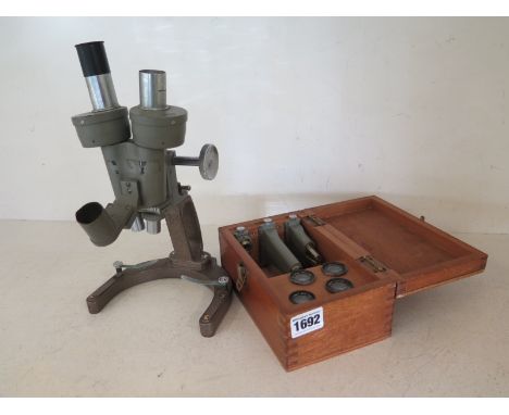 A vintage 1950's Beck London Microscope no. 14456 with a boxed set of attachments and lenses 
Condition report: Some usage we