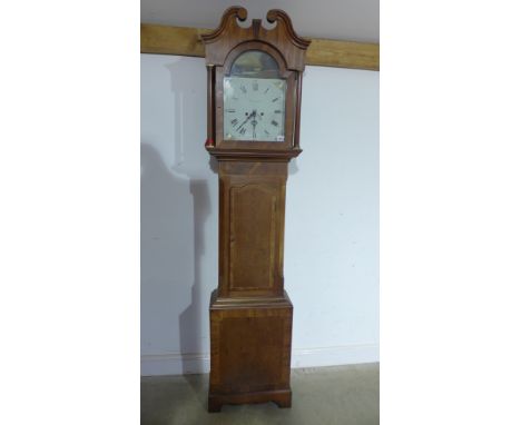An 8 day longcase clock with a painted arched dial contained in a good quality mahogany crossbanded case standing 225cm tall