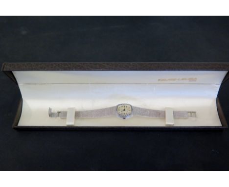 An 18 ct gold white gold diamond studded ladies FAVRE-LEUBA manual wind bracelet wristwatch - Weight approx. 38.5 grams 
Cond