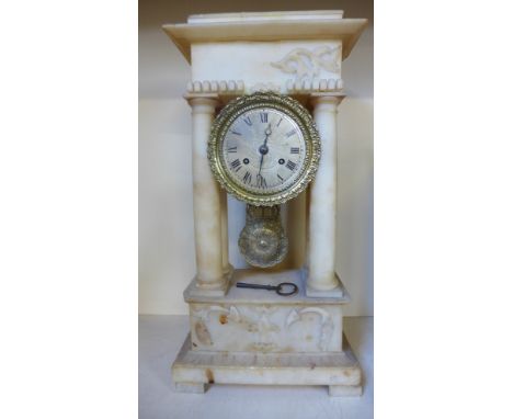 A 19th century white marble/alabaster Portico mantle clock with a silvered dial striking on a bell - Height 46cm x Width 23cm