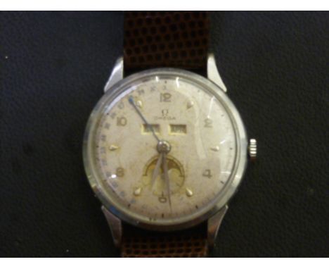 A rare 1948 Omega Cosmic Moonphase model 2486-1 Gentleman's wristwatch, stainless steel case having silvered dial with Arabic