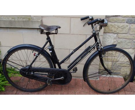 A vintage Raleigh bicycle, 3 speed, Sturmey Archer cassette, leather saddle