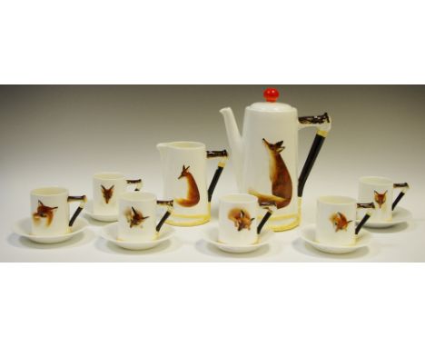 `Reynard The Fox` -  a Royal Doulton coffee set, modelled in low relief with a seated fox, the handles modelled as a riding c