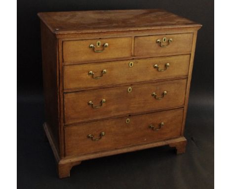 A George III oak chest, of two short and three long graduated cockbeaded drawers, bracket feet, 95cm wide, c.1800