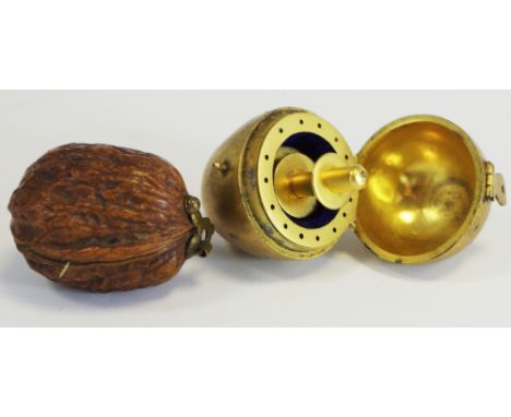 Sewing - a 19th century gilt metal egg shaped novelty seamstress's companion, hinged cover enclosing a spoon provision for ne
