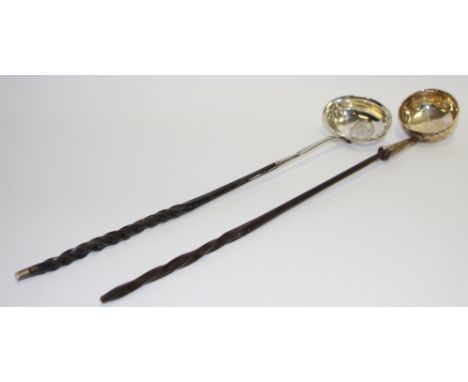 An 18th century silver toddy ladle, wrythen whale bone handle, 38cm long;  another (2)