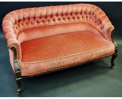 A Victorian mahogany button back two-seat sofa, upholstered in pink, c.1870