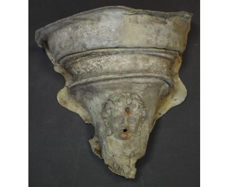 An 18th century Country House lead hopper, applied with a cherub mask, 41cm high