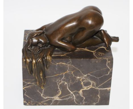 French Scool, a  bronzed figure of a prostrate nude lady,  on a marble plinth, foundry mark Garanti Paris, J.B. Deposee