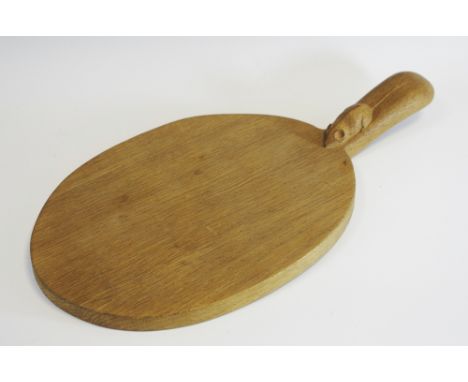 Robert Thompson, Mouseman of Kilburn - an oak cheese board, carved mouse signature, 39.5cm long