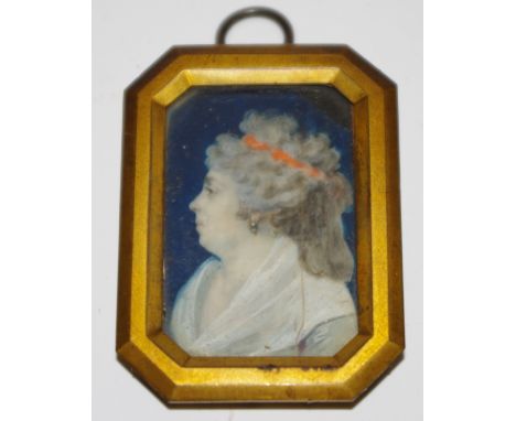English School, 19th century, a portrait miniature, of a middle aged lady with orange ribbon in her hair, watercolour on ivor