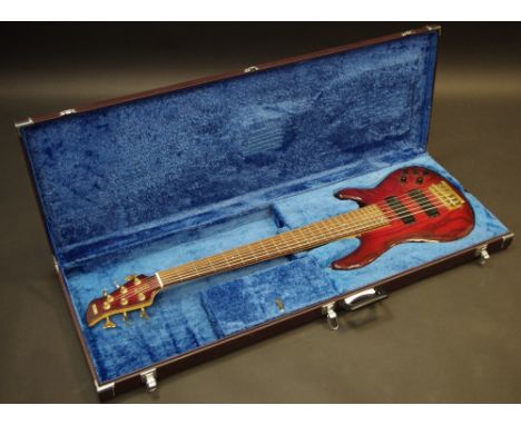 A Yamaha 7RB 6-string bass electric guitar, in faux mahogany,  cased, c.1980