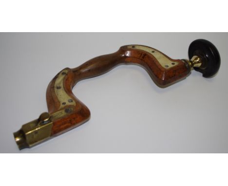 A brass plated button pad beech brace by John Wilson, Sheffield.