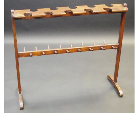 A late Victorian/Edwardian mahogany boot and whip rack, sledge base, 84cm high, 96cm wide, c.1900