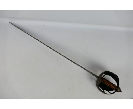 A cavalry type basket hilt sword, possibly 18th century, 81 cm double fullered blade, turned wooden wire bound grip and dome 