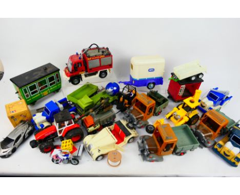 Dickie Toy - A collection of unboxed plastic vehicles in various scales. Lot includes Dickie Toy fork lift truck; Postman Pat