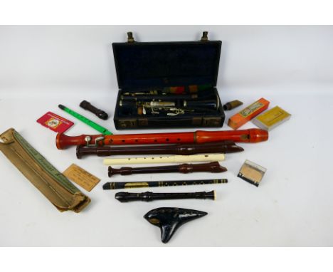 Various musical instruments to include a Schott's Concert tenor recorder, an Austrian EWA ocarina, a cased Sterling clarinet 