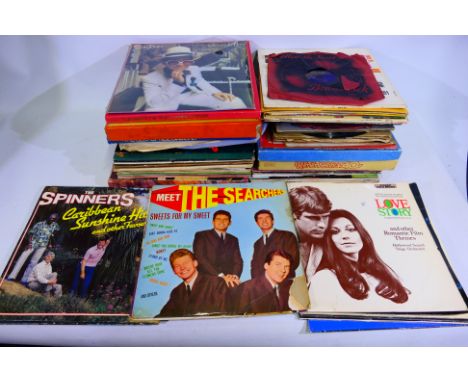 A collection of 12" and 10" vinyl records. Lot includes Abba, Michael Jackson, The Spinners, and similar. Predominantly 12" r