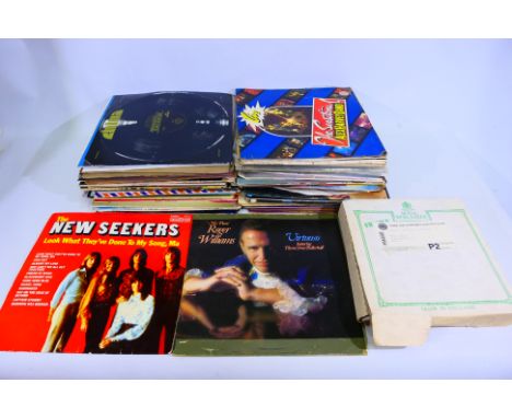 A collection of 12" and 10" vinyl records to include Lennon and McCartney Tijuana Style, The Best of Dolly Parton, Spandau Ba