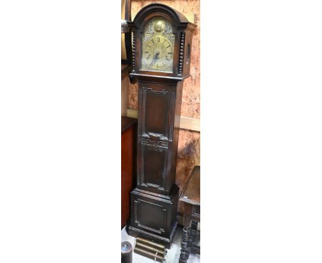 A 1920s eight-day three train oak longcase clock in the 18th century manner, with brass dial a/f (pendulum and weight present