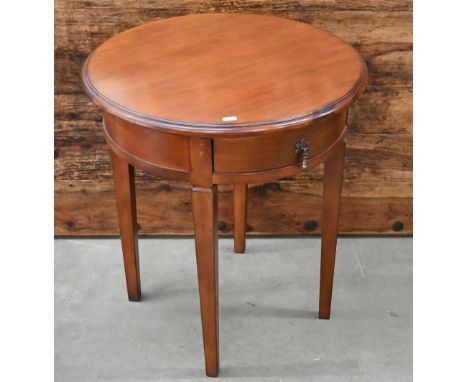 A circular cherrywood Barker &amp; Stonehouse 'flagstone' lamp table with single drawer and tapering square supports, 54 cm d