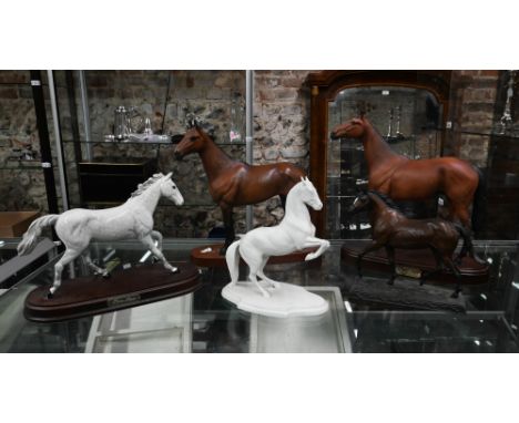 Two Royal Doulton racehorses - One Man DA266 and Red Rum to/w a Beswick example, Arkle, a Levade bisque rearing horse and a F