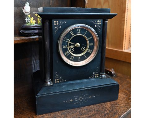 A late 19th/early 20th century architectural mantel clock with brass classical columns, twin-train eight day movement strikin