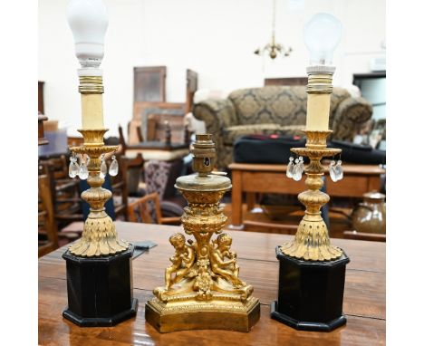 19th Century ormolu triform lamp-base, mounted with three musical putti, 20cm high, to/w a pair of gilt metal lamps cast with