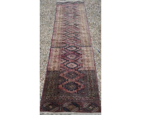 An old Afghan washed red ground runner, 281 cm x 76 cm 