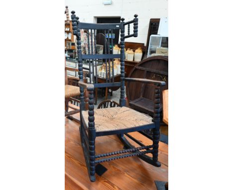 Antique ebonised bobbin framed rocking chair with woven rush seat&nbsp; 