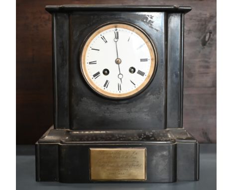 A late 19th century architectural slate mantel clock with twin-train drum movement striking on a bell, the case with presenta